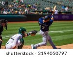 Small photo of Oakland, California - August 21, 2022: Seattle Mariners outfield Mitch Haniger bats against the Oakland Athletics at the Oakland Coliseum.