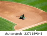 Small photo of Oakland, California - July 27, 2022: Clay Wood, the Oakland Athletics head groundskeeper since 1994, drags the infield before an Athletics game against the Houston Astros at the Oakland Coliseum.
