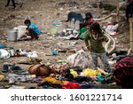 Small photo of Dehradun, Uttarakhand, India - February 13, 2018 Poor homeless children living on street during winter with their families near Parade Ground in Dehradun.