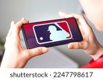 Small photo of January 11, 2023, Brazil. In this photo illustration, the Major League Baseball (MLB) logo is displayed on a smartphone screen