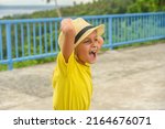 a little curly haired boy... | Shutterstock . vector #2164676071