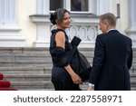 Small photo of Berlin, Germany - March 29, 2023: Gesine Eisfeld and the CEO of Rolls Royce Germany Dirk Geisinger arrive in front of Bellevue Palace for the state banquet for King Charles III.