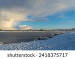 Small photo of scenic cloud over the biotope Kleiputte in Brake Unterweser (Germany) during a sunny and snowy winter day
