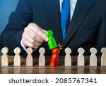 Small photo of Replacing undesirable employee. The businessman makes a replacement. Substitution of subordinate. Replacement of leading posts by affiliated people. Control over company. Staff optimization