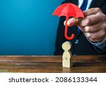 Small photo of Insurance agent holds an umbrella over a men with a crack. Rehabilitation after trauma, drugs, alcohol. Health and life insurance. Psychological help. Social support. Recovery. Protectorate, patronage