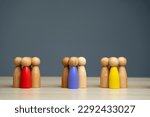 Small photo of Groups of multicolored wooden people on a gray background. The concept of market segmentation. Target audience, customer care. Market group of buyers. Customer relationship management. Selective focus