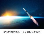 space rocket flies in the starry sky over the amazing blue planet earth and yellow sunset. Spaceship with blast flies into outer space. Travel to other planets concept. Successful start