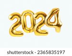 Happy new year 2024 metallic gold foil balloons on a white background. Golden helium balloons number 2024 New Year. 