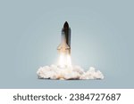 Small photo of Creative shuttle rocket takes off successfully with blast and clouds of smoke on a blue background, concept. Spaceship launches, creative idea. Start up.