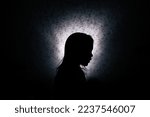 Silhouette of a little girl in...
