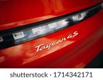 Small photo of Riga, LV - APR 24, 2020: Porsche Taycan 4S first luxury electric auto logo at the thunk lid