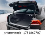 Modern sedan car open trunk. Car boot is open and ready for luggage loading. Empty space at the boot of sedan car
