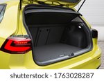 Modern hatchback car open trunk. The car boot is open for luggage. Car prepared for a drive and waiting after passengers 