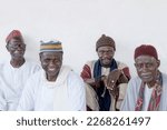 Small photo of Editorial Caption: Dakar, Senegal, Africa, September 3, 2021 Four smiling Muslim men, a Friday in Senegal. Unidentified old Muslim men waiting for the opening of the mosque, celebration clothing