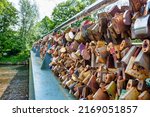 Small photo of Bakewell, UK- May 15, 2022: The thousands of pad locks on the Bakewell Love Locks Bridge.