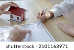 Small photo of Contract signing, Home broker or salesperson allows customers to sign a contract to purchase a home as a legitimate homeowner, Transfer of ownership, Buy a new house.