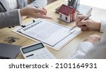Small photo of Contract signing, Home broker or salesperson allows customers to sign a contract to purchase a home as a legitimate homeowner, Transfer of ownership, Buy a new house.