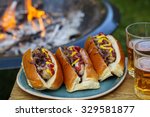Hot Dogs With The Camp Fire In...