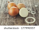 White Onions On A Cutting Board