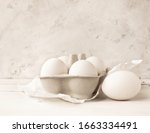fresh white eggs in a tray on a ... | Shutterstock . vector #1663334491