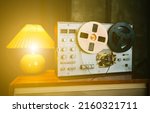 Small photo of Vintage room with Wiretapping on the reel tape recorder. Retro old school spying on conversations. Intelligence gathering. Espionage concept.