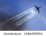 Passenger plane flies in front of blue sky and leaves contrails
