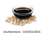 Bowl of tasty soy sauce and beans isolated on white
