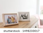 Family Portraits In Frames On...
