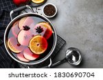 Delicious mulled wine and ingredients on grey table, flat lay. Space for text