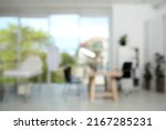 Blurred view of modern medical office with doctor