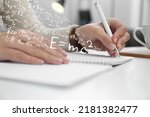 Small photo of Science and education concept. Illustration of basic physics and mathematics formulas and woman working at table, closeup