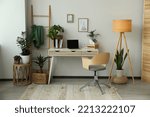 Home office interior with different beautiful houseplants