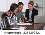 Small photo of Couple consulting with professional notary in office