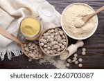 Small photo of Flat lay composition with different types of brewer`s yeast on wooden table