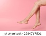 Small photo of Closeup view of woman with varicose veins on pink background. Space for text