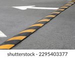 Striped speed bump on street. Road safety