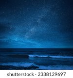 Amazing starry sky over sea at...
