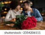 International dating. Happy couple spending time together in restaurant, selective focus