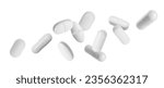 Small photo of Many different pills falling on white background