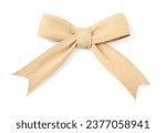 Bow made of burlap fabric isolated on white, top view