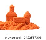 Small photo of Castle figures made of orange kinetic sand isolated on white