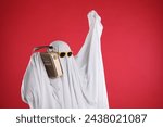 Person in ghost costume and...