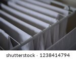 Small photo of (foldout) drying rack: white shirts on the clotheshorse from the homemaker
