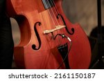 Small photo of double bass close-up, double bass details. musician plays double bass on stage, close-up