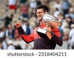 Small photo of Novak Djokovic of Serbia with the trophy ("La Coupe des Mousquetaires") during the French Open final, Grand Slam tennis tournament on June 11, 2023 at Roland Garros stadium in Paris, France.