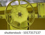 Small photo of Yellow rail car steering wheel.