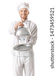 Small photo of Handsome male chef with tray and cloche on white background