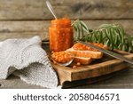 Small photo of Healthy sea buckthorn jam with bread on table