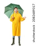 Small photo of Young man in raincoat and with umbrella on white background