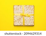 Small photo of Jewish flatbread matza for Passover on color background